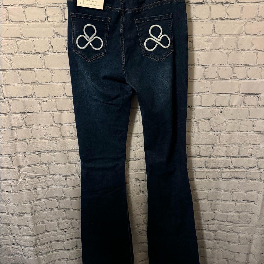 Blue Boot Cut Jeans with Unique Circular Embellishments